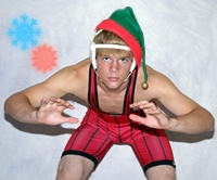 Wrestler with Green Santa Hat 