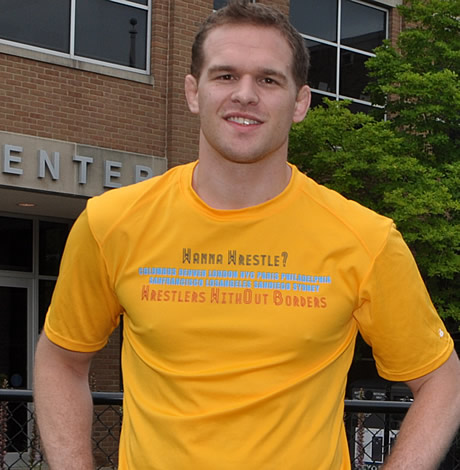 Hudson Taylor in a yellow 'wanna wrestle' shirt