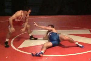 Wrestler dancing on the mat